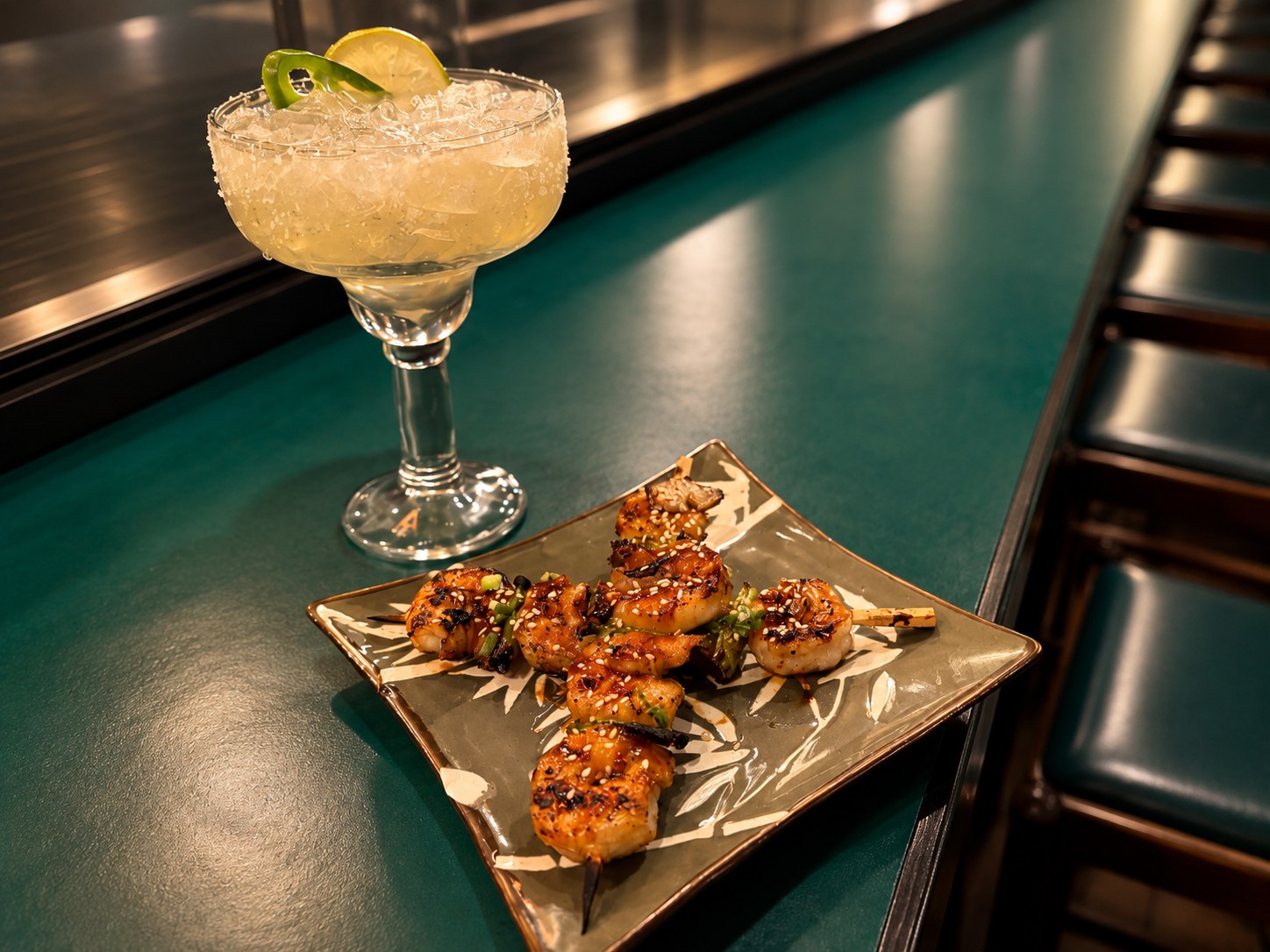 Grilled shrimp skewers and margarita at the Suehiro bar