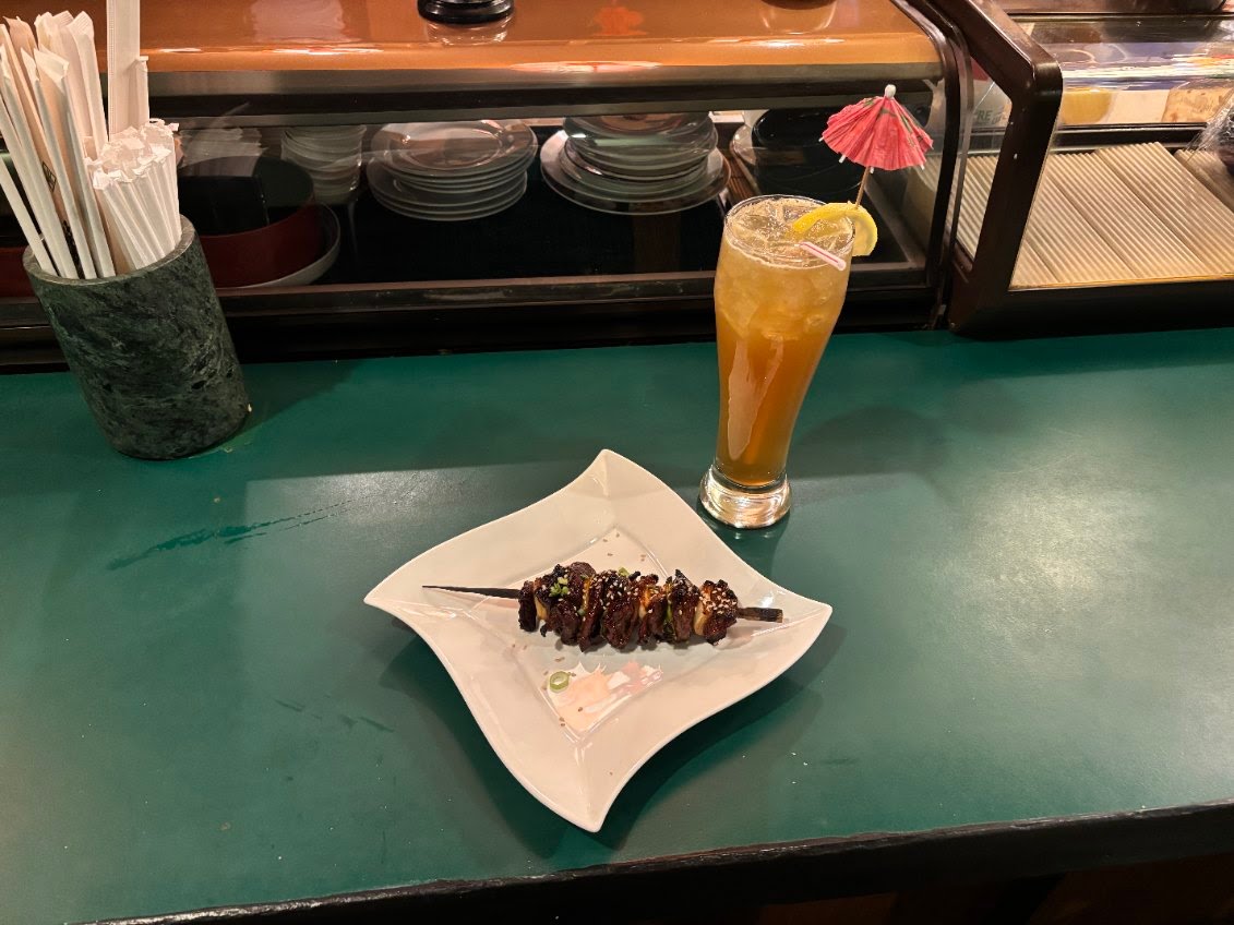 Grilled yakitori skewers and iced tea at the Suehiro sushi bar